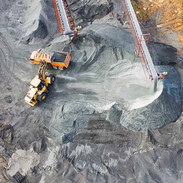 This is an image of an excavator working in what appears to be a coal mine