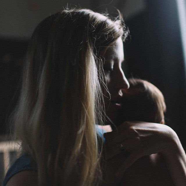 woman holding small baby