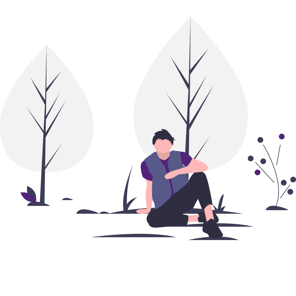 student sitting down and relaxing in the woods