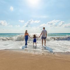 A family in the surf at the beach