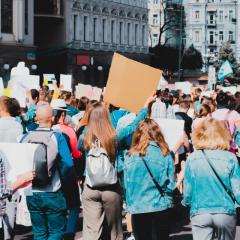 Group of protesters with placards walking