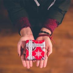 Hands giving present